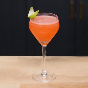 Strawberry Daiquiri drink with a lime twist as garnish